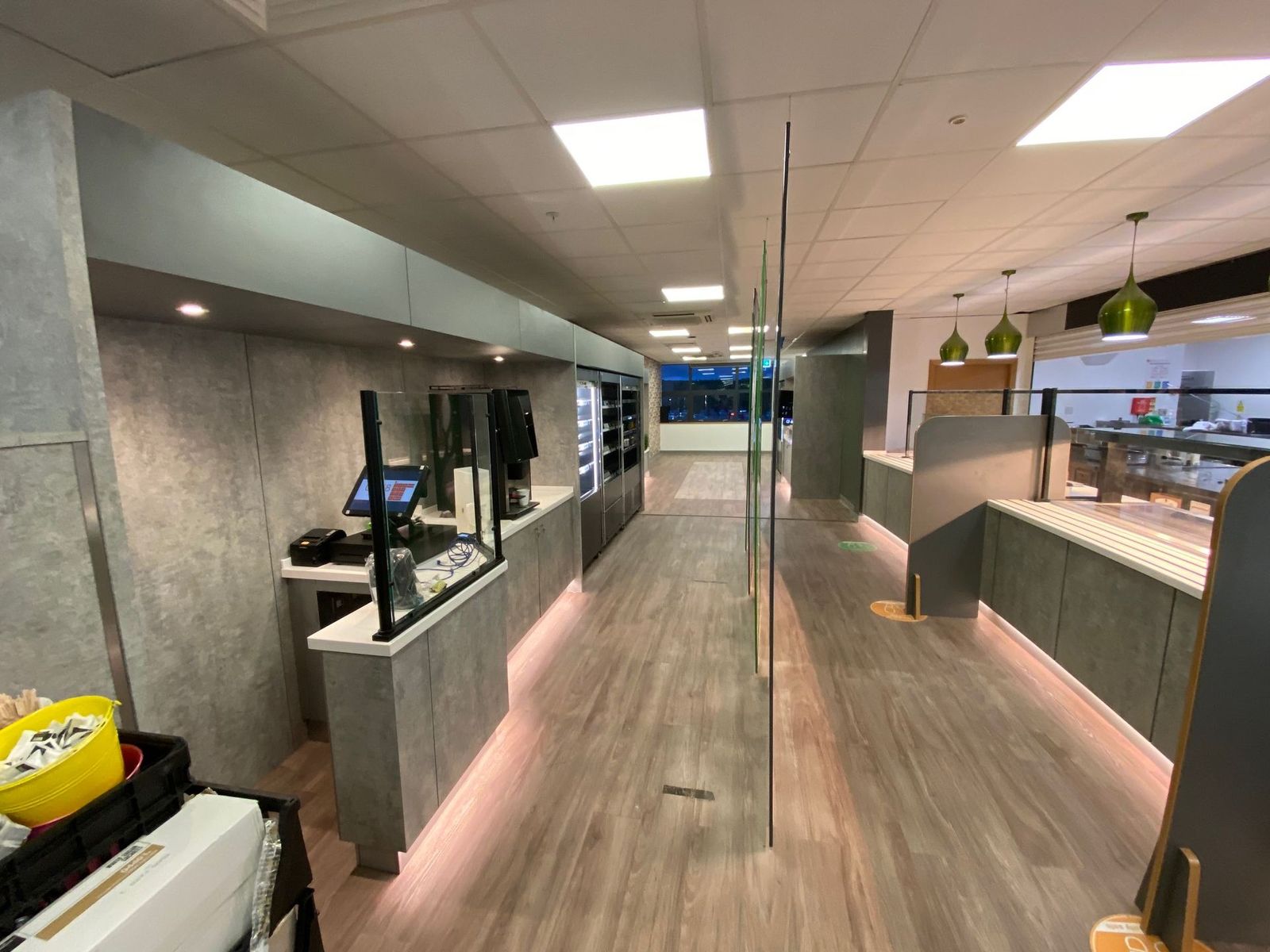 Wood-effect flooring fitted in a commercial servery area